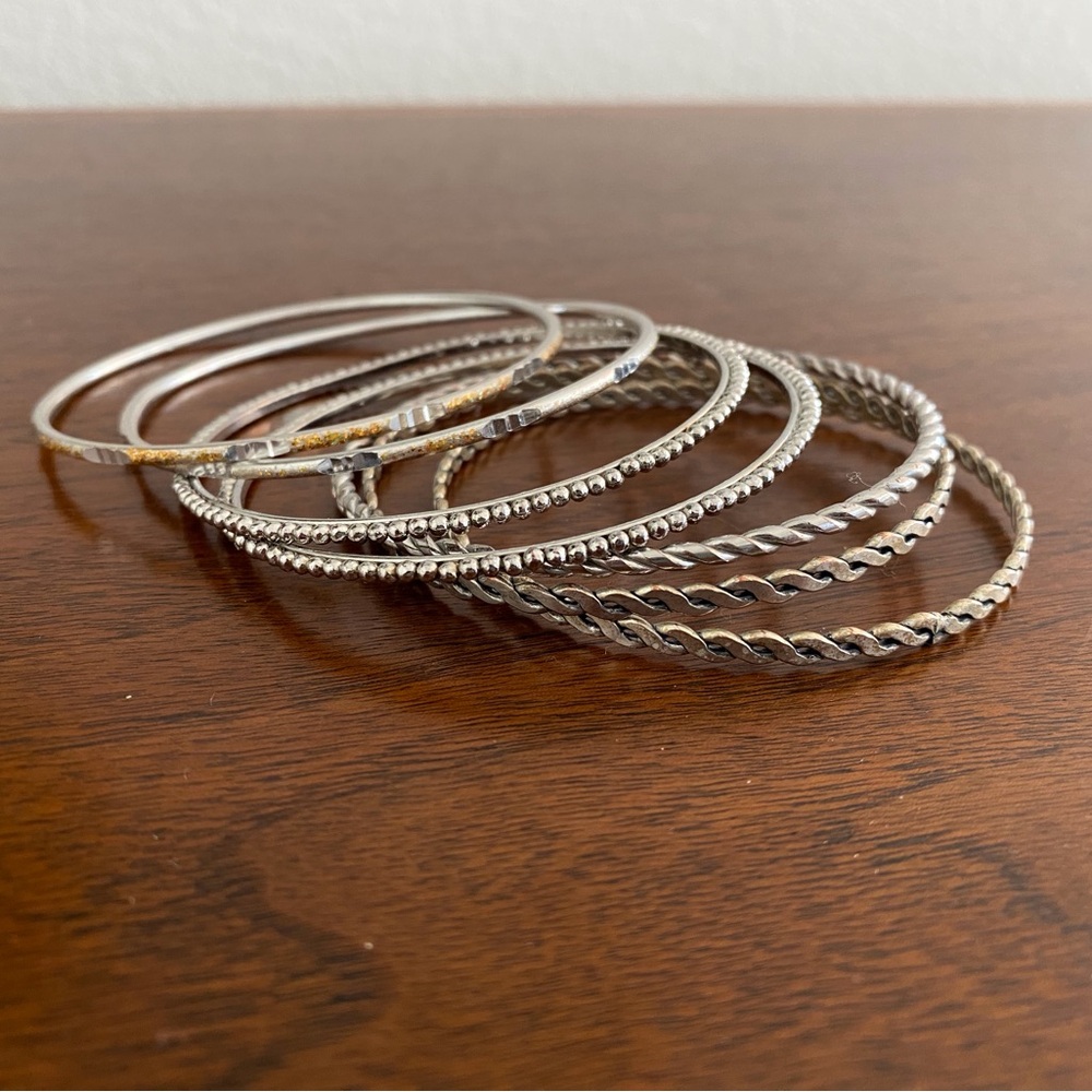 Set of Seven Elegant Silver Bangle Bracelets!
